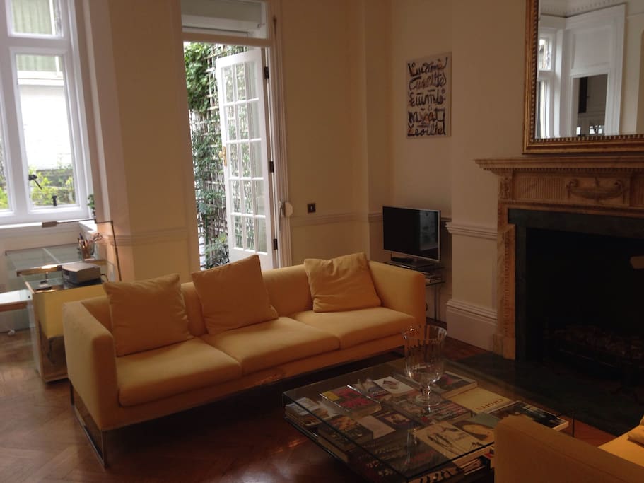 Living room with door to the outdoor patio.