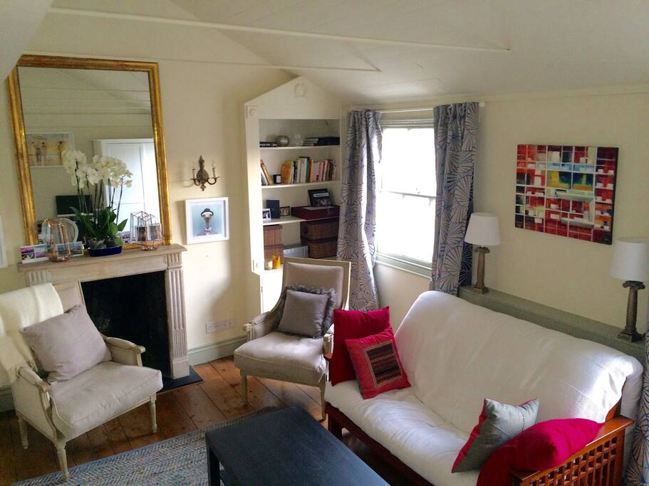 The living room, decorated with care. The sofa is a sofa bed.