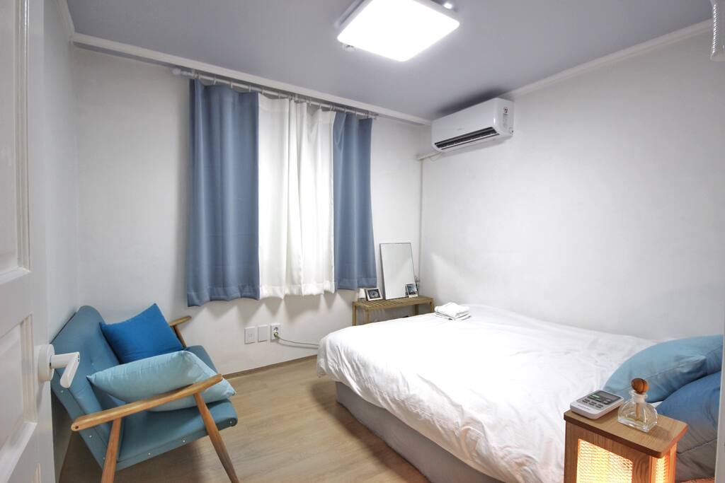 AC inside the room, a queen-size bed with a comfy two-seater sofa, and a little vanity for your convenience ;)