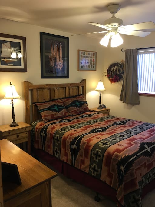 Smaller bedroom #2 for two. Features southwest style bed set.