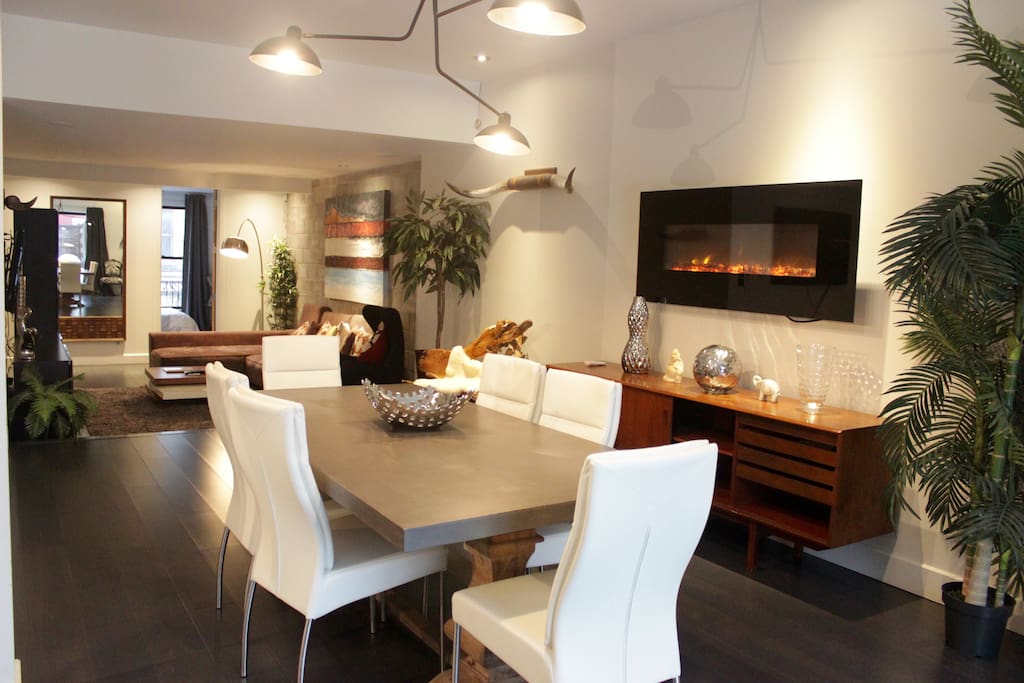 Large open common space with dining room, living room and kitchen