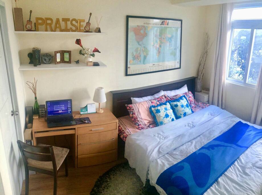 Master Bedroom: hanging shelves + 1 bedside table near the window