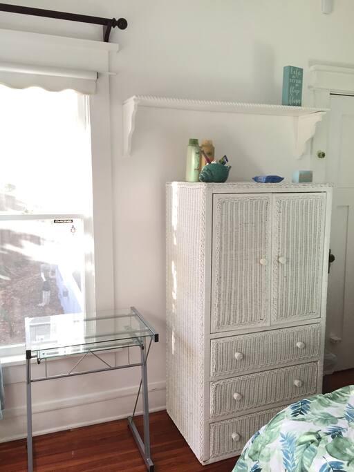 A little workspace for your laptop & drawers for your clothes.