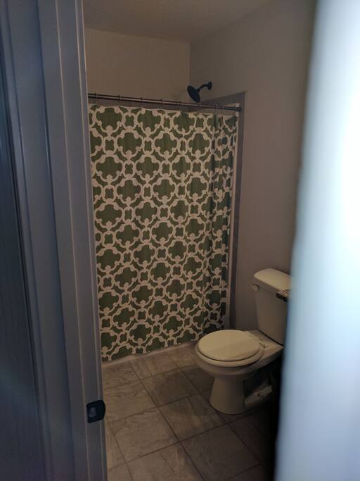 The guest bathroom, the bathroom door locks, single vanity sink. Towels will be provided