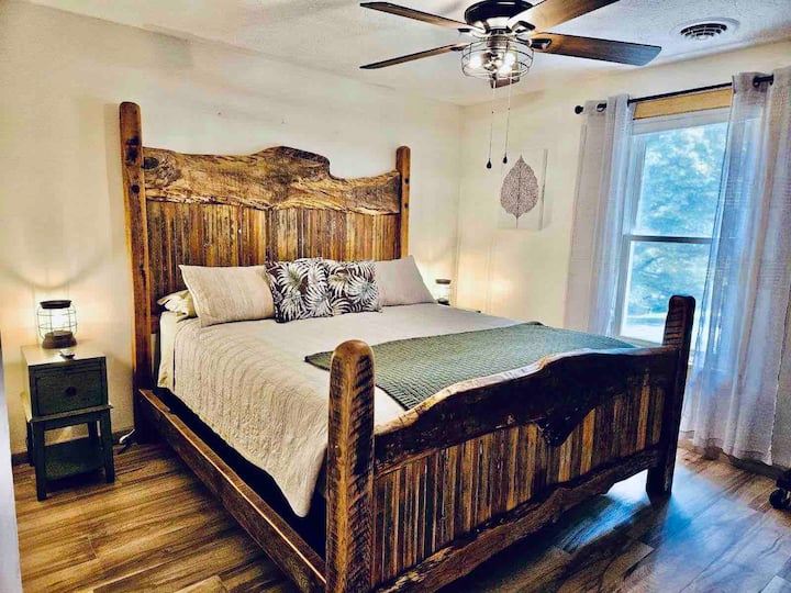 Comfortable bed with a warm, rustic touch. A relaxing place to unwind at the end of the day.