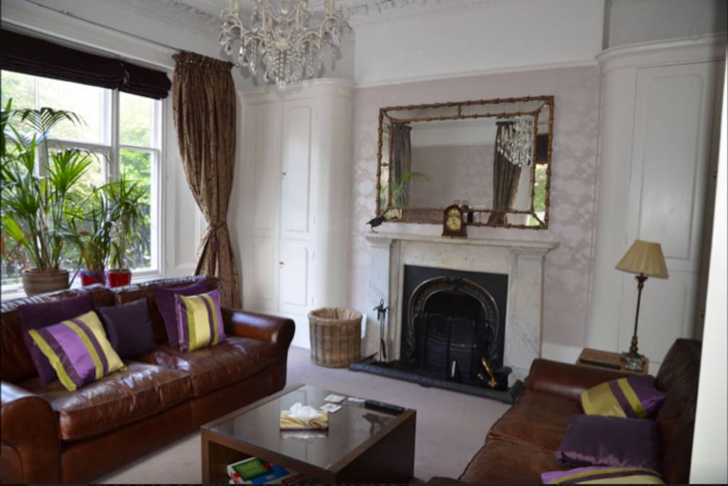 One of two sitting rooms with open fire