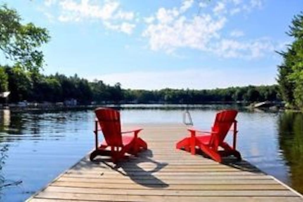 Muskoka chairs on the dock.