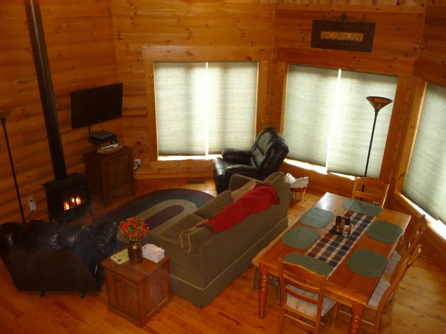 Enjoy family time in our warm log great room!