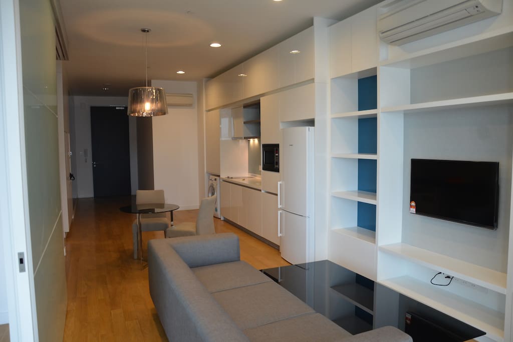 Designer styled luxury interior, comfy sofa with flat screen TV and DVD
