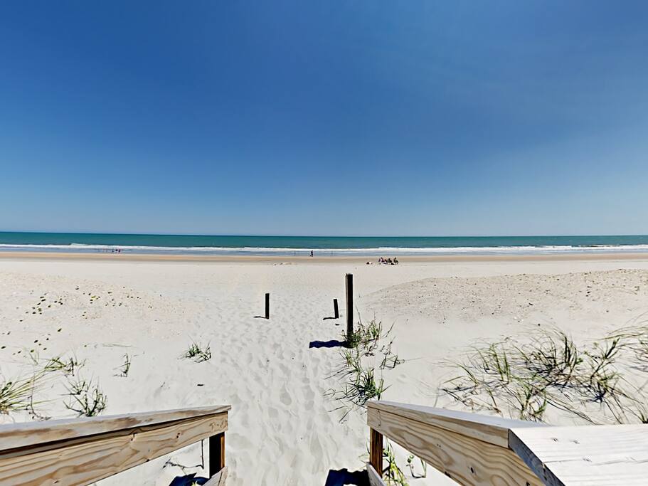 Enjoy a fun-filled day in the sun at the beach, just a short walk from your rental.