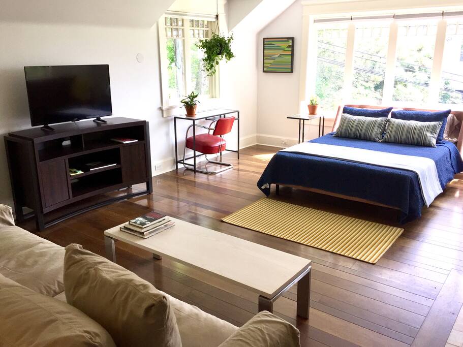 Large flat screen tv with Apple TV. Every window has individual shades that can be pulled down for privacy.
