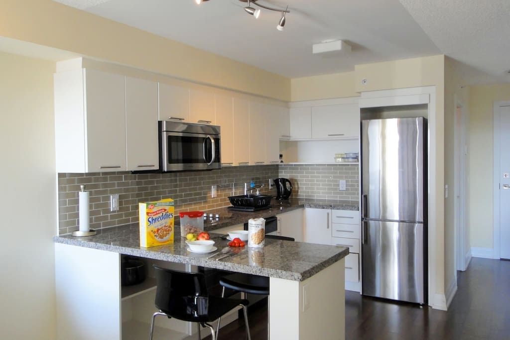 Modern kitchen with all appliances and utensils and breakfast island