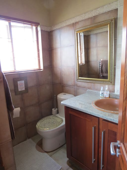 Bathroom with heated towel-rail.