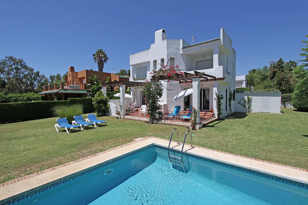 Villa 1 pool view to villa - terrace