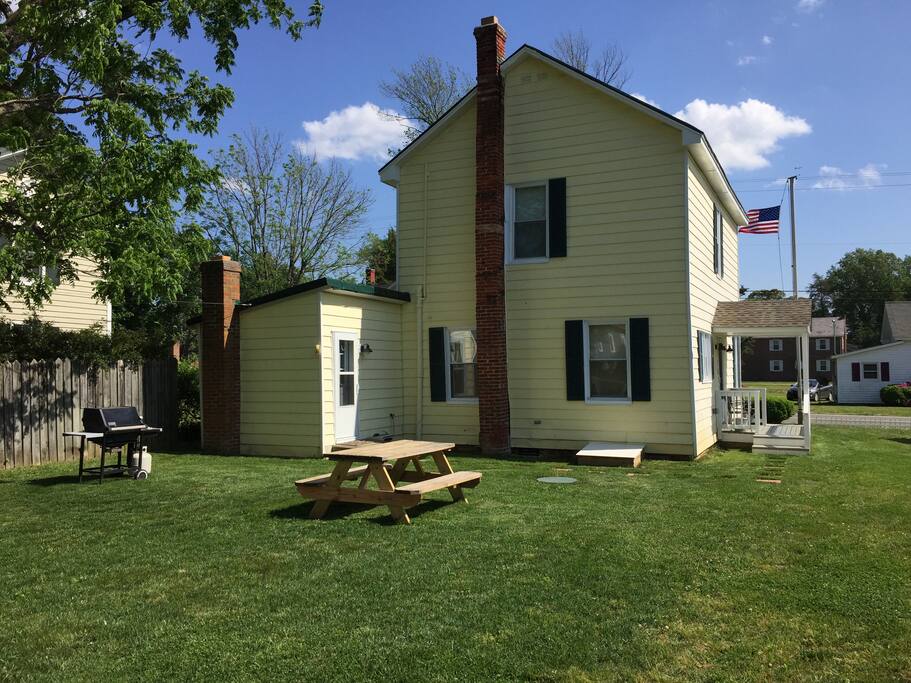 Rear yard with picnic table and grill