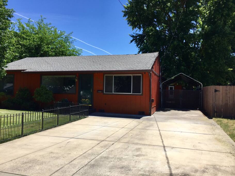 Driveway with covered parking area.
