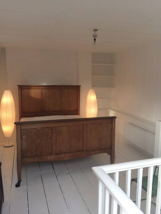 Romantic all-white loft room, with double door to roof terrace