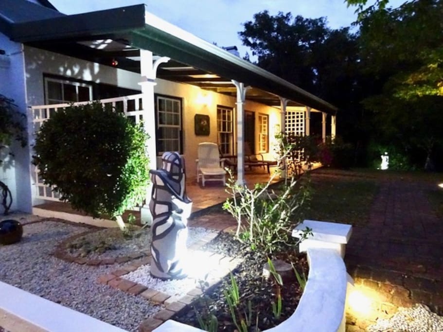 Sazzzman's Guestroom's Entrance with a lovely veranda & garden to enjoy at sunset.