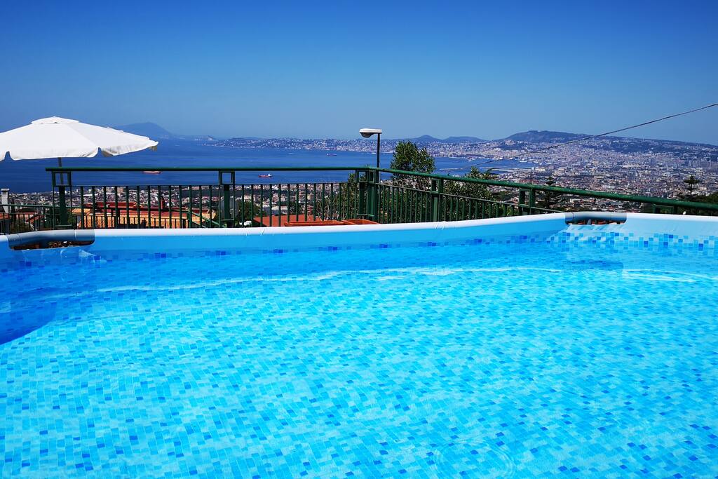 Private exclusive pool on the terrace with solarium and view of the bay of Naples, Sorrento Capri