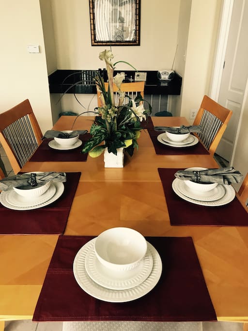 The 6 seater dining table in the living area.