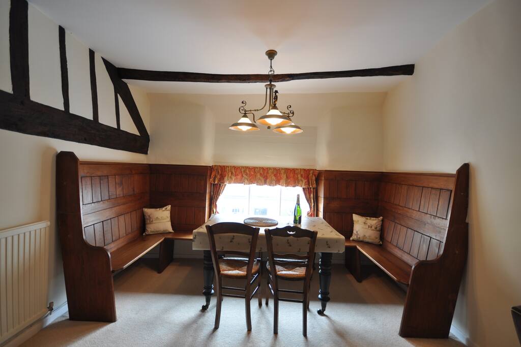 The dining table with old wooden pews