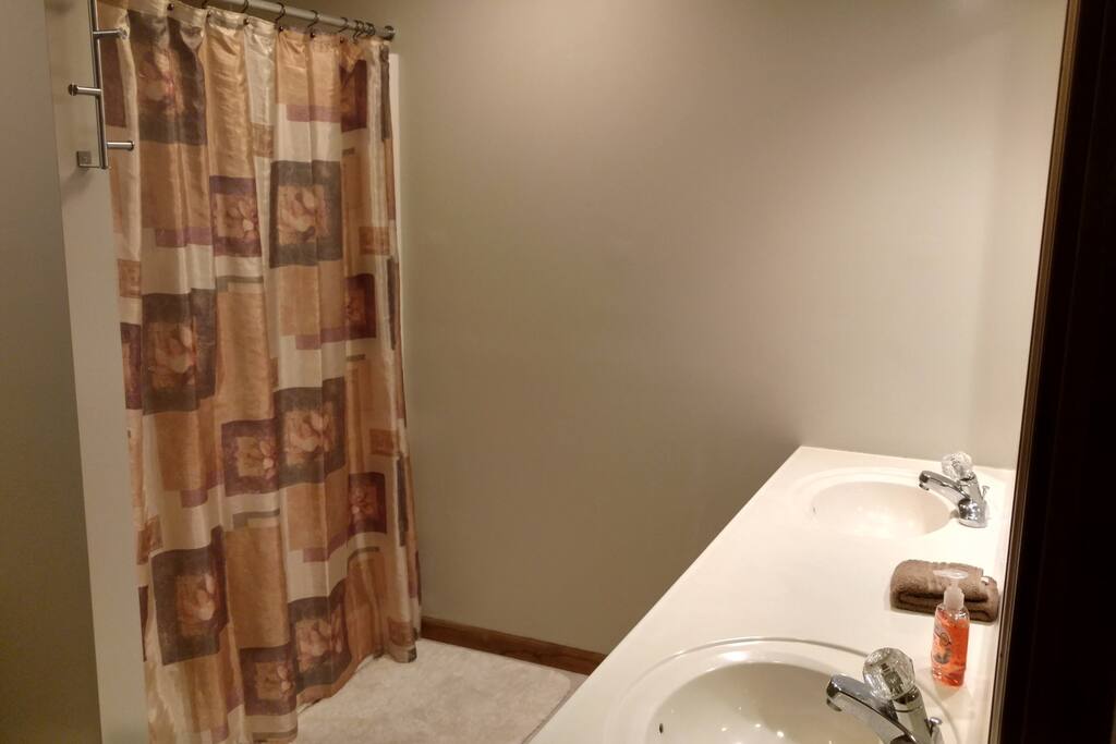 Private bathroom with shower and double vanity