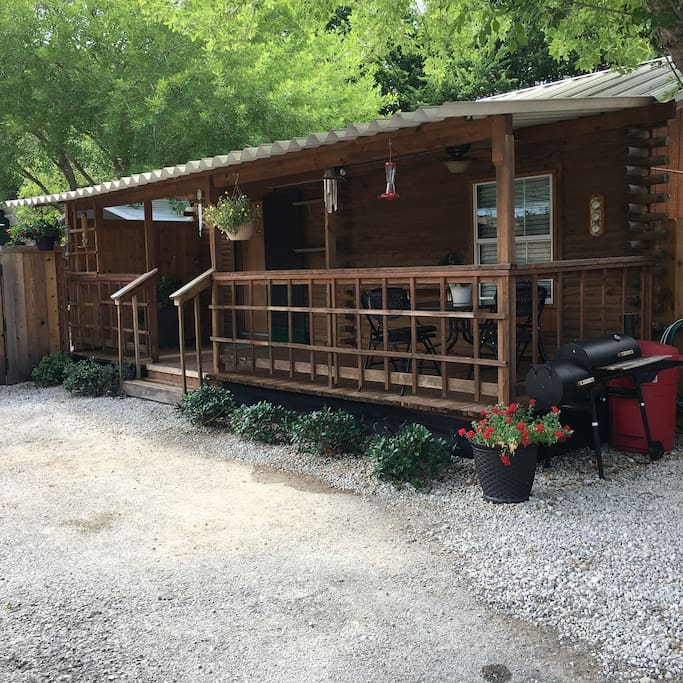 Front of cabin there is a nice shaded common area across the parking lot!