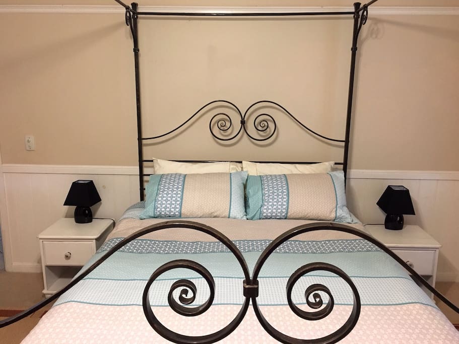 Queen sized wrought iron four poster bed