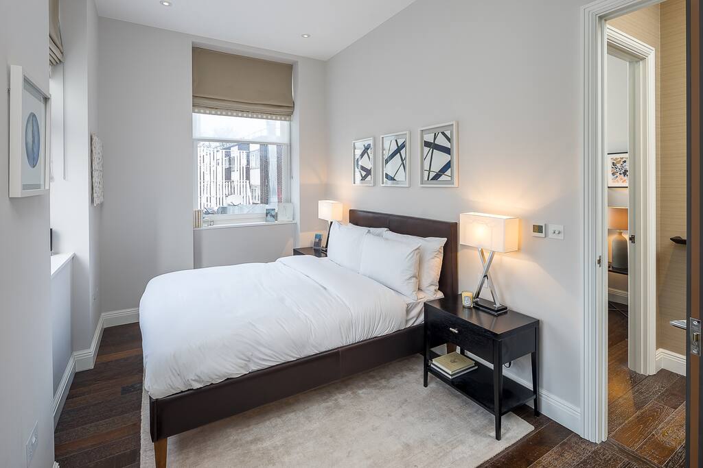 This master room has a double bed and an en suite bathroom.