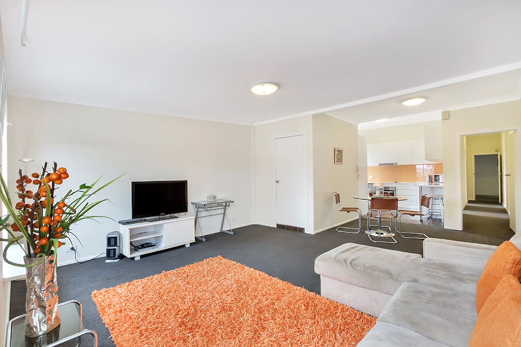 Open plan lounge, area with dining table that flows on to the kitchen. Laundry cupboard with washing machine & dryer, within the fully equipped kitchen.