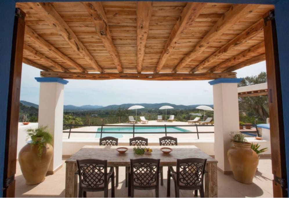 Front terrace dining area, over looking the pool and gardens.