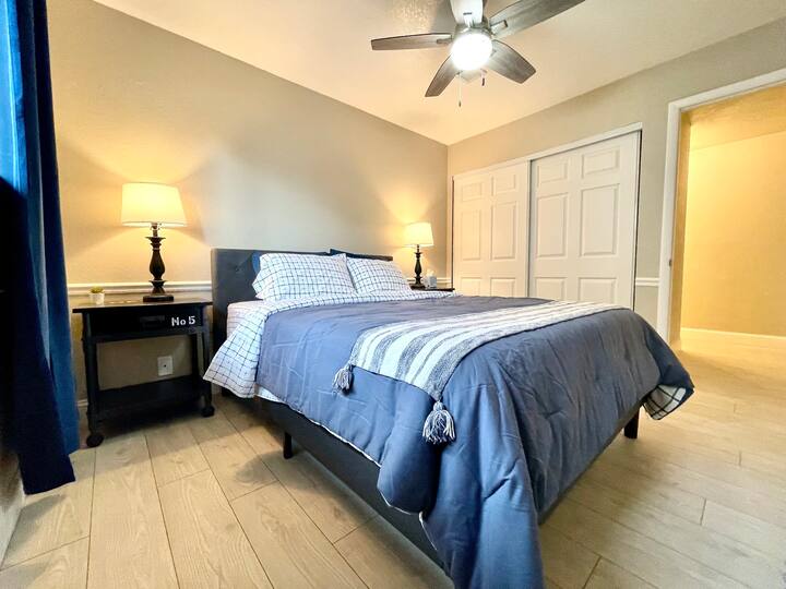 Bedroom #2 includes Queen bed, closet, charging lamps, & dresser