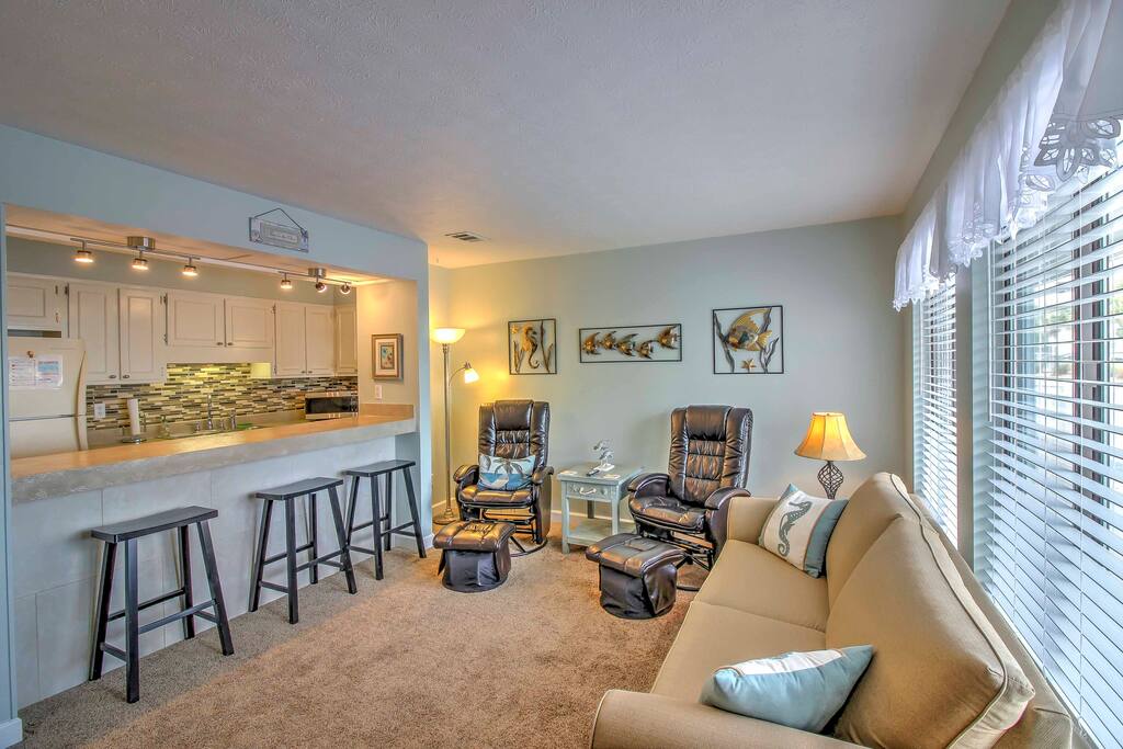 When you're not exploring the PCB area, relax in the living room with a couch and 2 leather chairs.