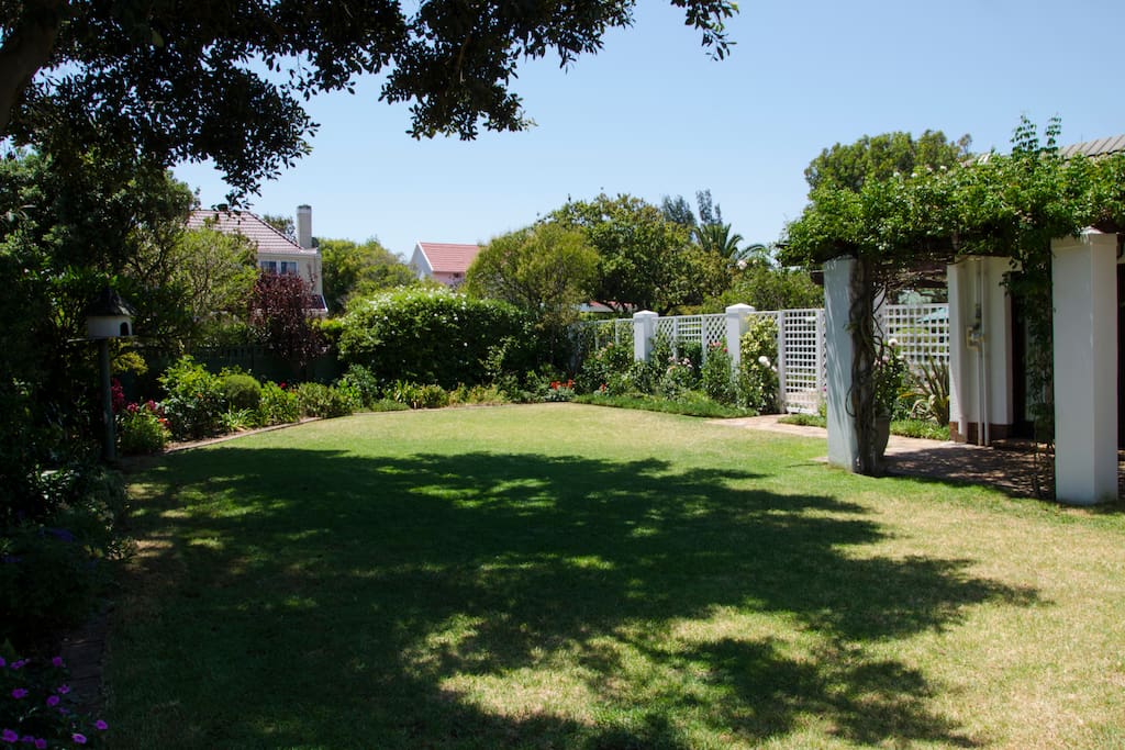 Landscaped front garden with fenced off access to the pool. (Sadly, greenery will depend on water restrictions)