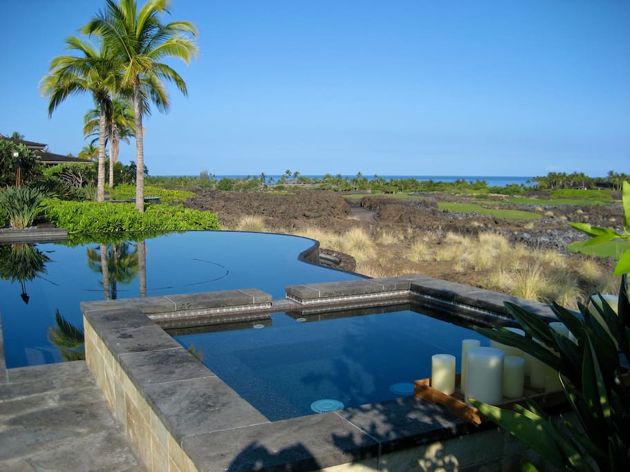 Infinity Pool by day with a view of Golf Course and Ocean