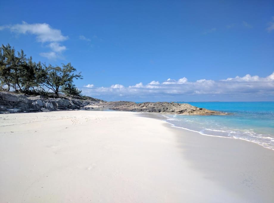 A white sand beach at the front of the property