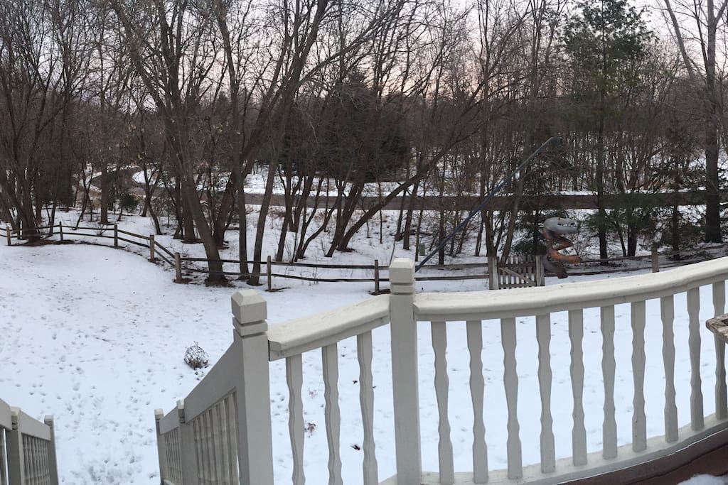 View of nature preserve from large backyard deck. Don’t be surprised to find deer, turkey, and small wildlife in this very private, quiet setting. Excellent walking and snowshoeing areas right out your back door.