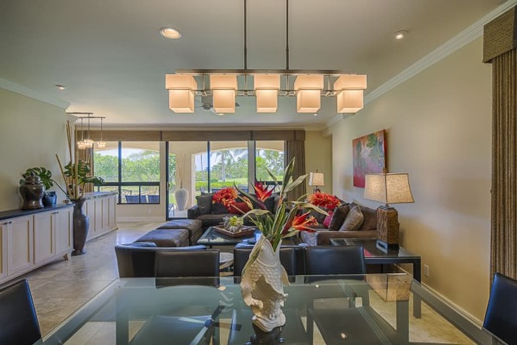 Spacious Living Room with twin oversized comfy sofas, Granite Wet Bar with Built-In Wine Fridge, Free WIFI, Large Sony TV with 200 channels. All upscale furnishings--travertine stone floors, 10' ceilings, recessed lighting, custom crown molding--opens onto 600 sq foot Lanai for true indoor/outdoor Hawaii Living.