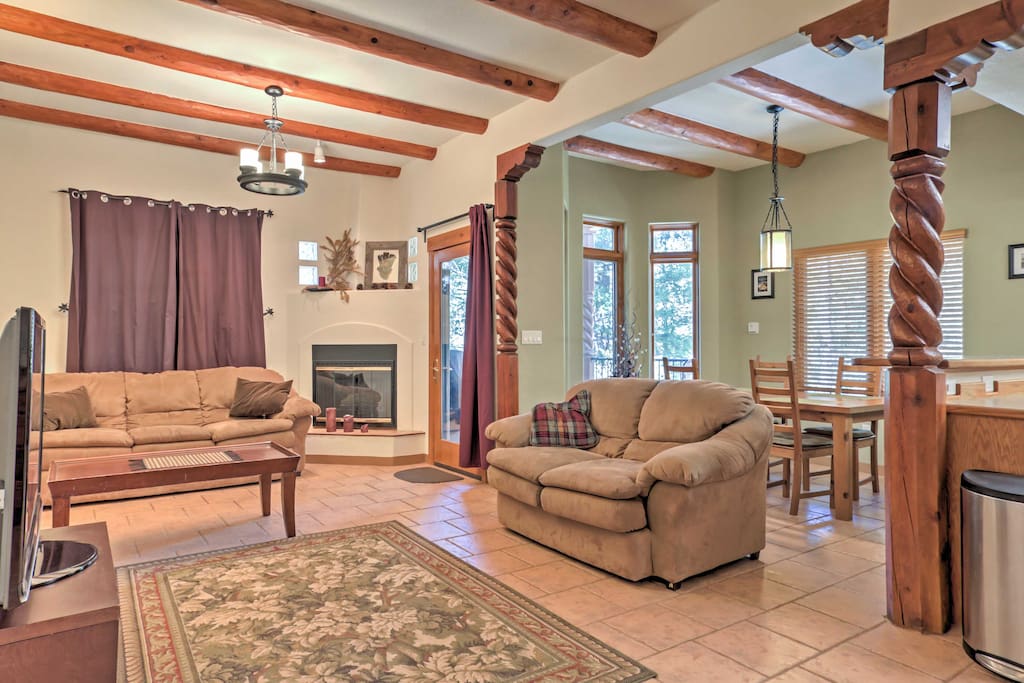 Enjoy lounging in the warmth of the gas fireplace on the comfortable sectional sofas in the main living area.