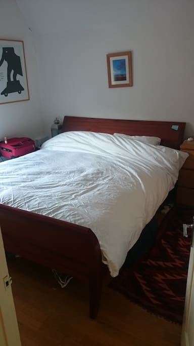 Master bedroom, superking mahogonay sleigh bed with 2 year old John Lewis mattress