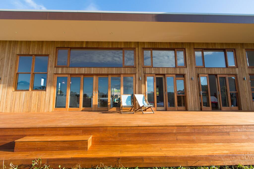 The front deck. From left: kitchen, living room, and the two downstairs bedrooms.