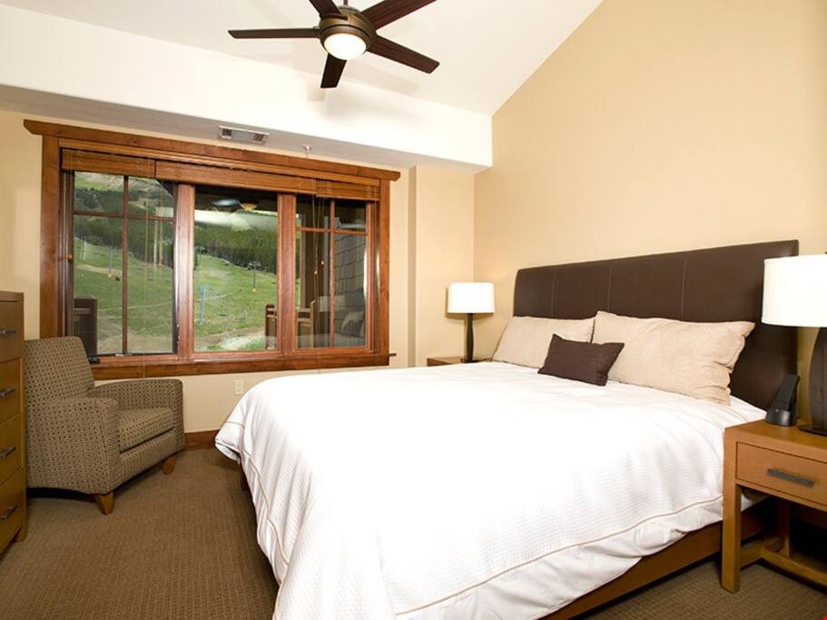 The master bedroom includes a comfortable king bed