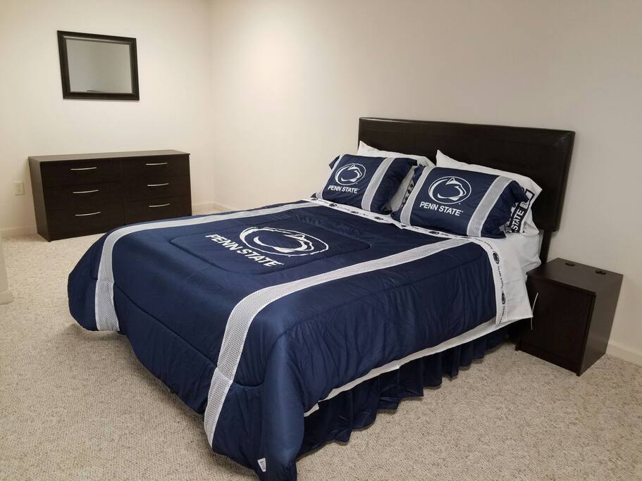 Queen size bed and dresser w/ mirror.