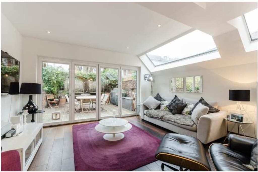 Living room leading out to the decked garden area