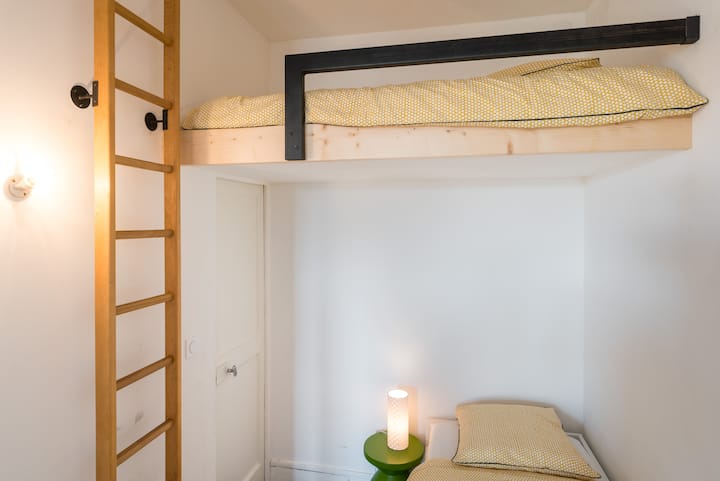 Small bedroom with large bed 140x190 and small bed 90x190 on mezzanine 
No windows but a large door opening on the over bedroom 