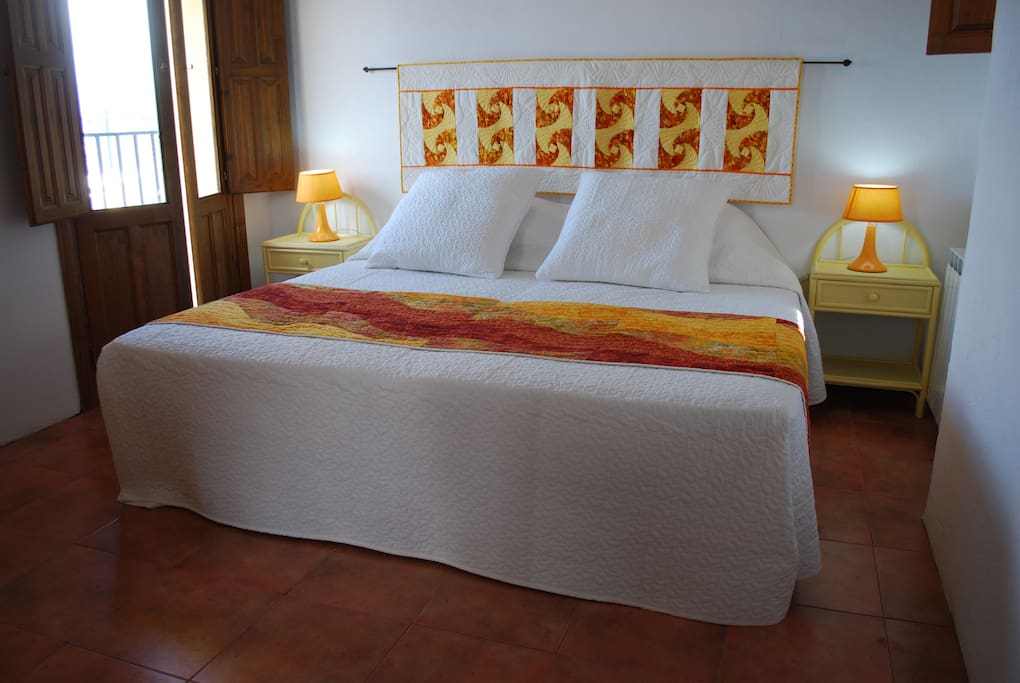 Super-kingsize bed, with French windows to a Juliet balcony