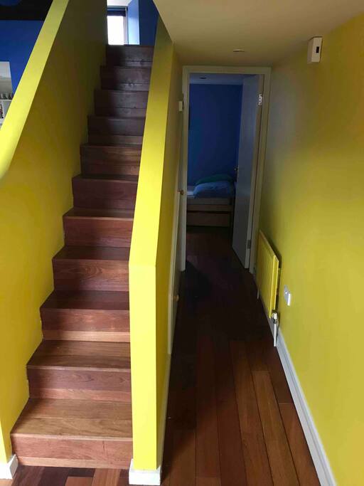 View of stairway and entry to single bed