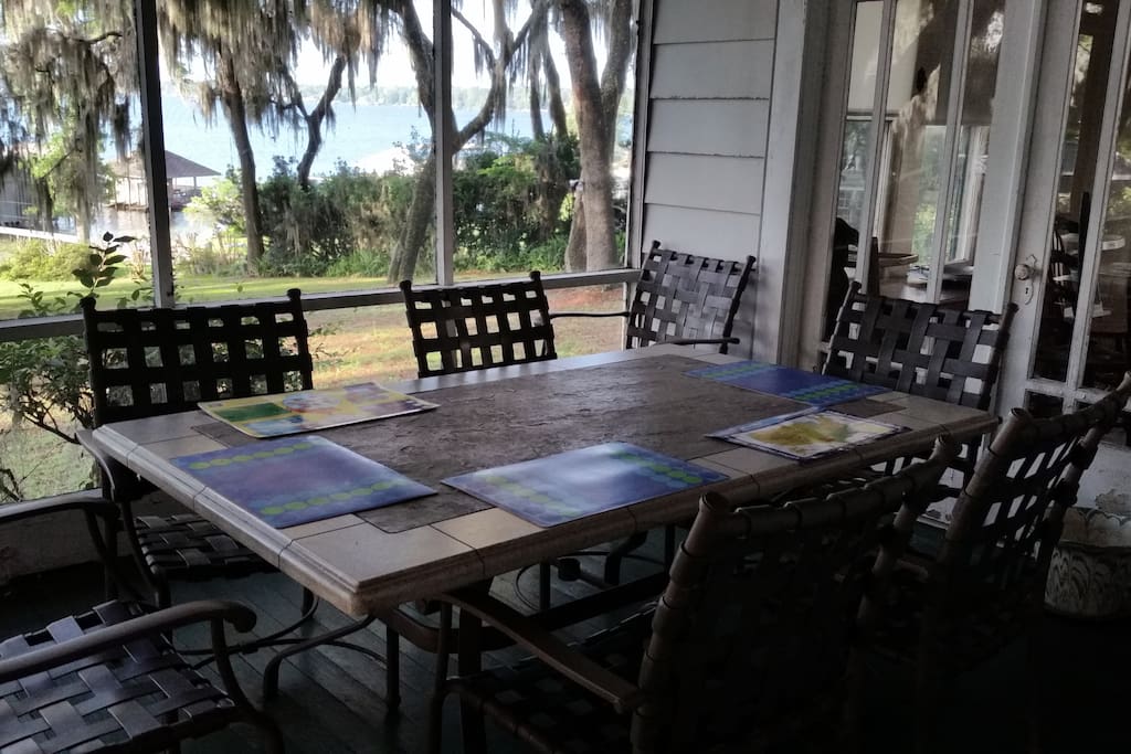 Other side of porch, with table for coffee, breakfast, or casual dining.