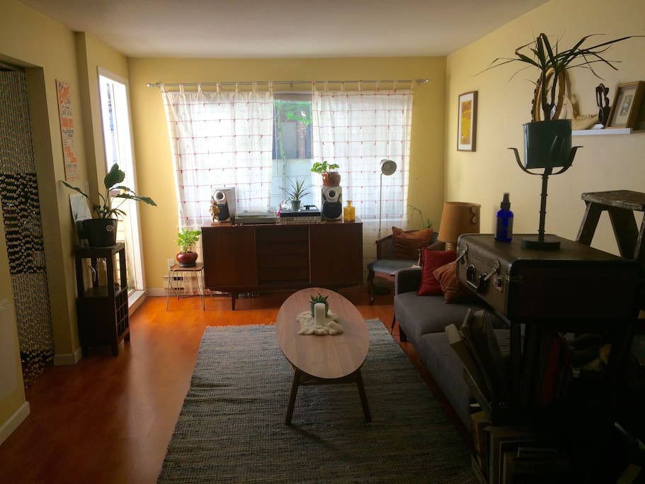 To the left is the kitchen and just beyond is a small, sunny patio.