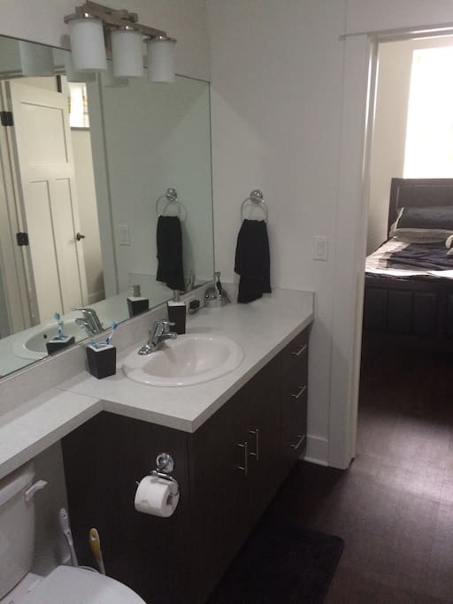 Spacious and modern bathroom with washer/dryer